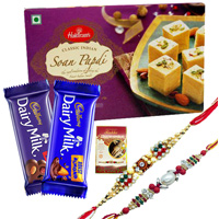 Exquisite Festive Favorite Sweets N Chocolate Gift Hamper with Two Rakhis With Free Rakhi Card to Rakhi-to-world-wide.asp