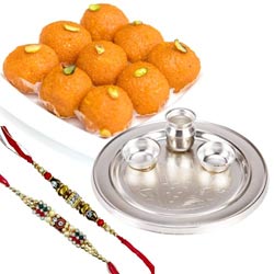 Delectable Haldirams Ghee Ladoo with Silver Plated Pooja Thali N Dual Rakhi Set to Rakhi-to-world-wide.asp