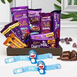 Splendid Doremon Rakhi with Cadbury Chocolate Treat Hamper to Rakhi-to-world-wide.asp