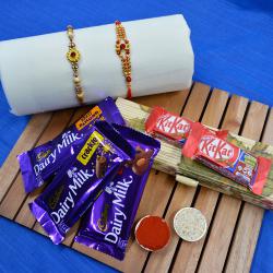 Cool Golden Rakhi Set N Chocolates Assortment in Bamboo Box to Rakhi-to-world-wide.asp