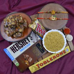 Designer Rakhi Set with Haldiram Sweets N Savory  N  Chocolates Hamper to Rakhi-to-world-wide.asp