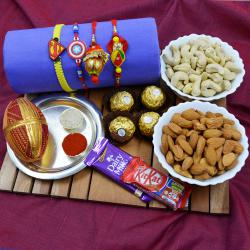 Fancy Family Rakhi Set with Puja Thali, Dry Fruits n Chocolates to Rakhi-to-world-wide.asp