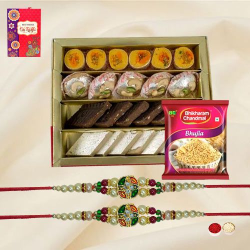 Gorgeous Twin Stone Rakhi Set with Tasty Mithai N Bhujia to Rakhi-to-world-wide.asp